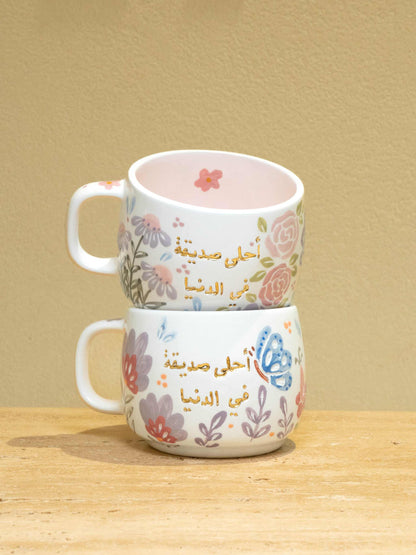 Personalized ceramic mug with gold Arabic monogram "Best Female Friend" and floral design.