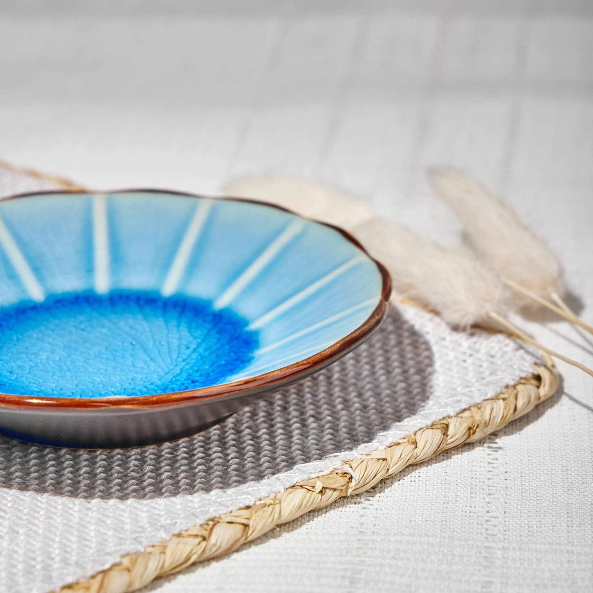 ACEM CERAMIC TEA PLATE/BLUEAdd a refreshing touch to your tea-time with the ACEM Ceramic Tea Plate in a vibrant blue shade. This stylish plate features a radiant sunburst design with a textureCeramic Plate