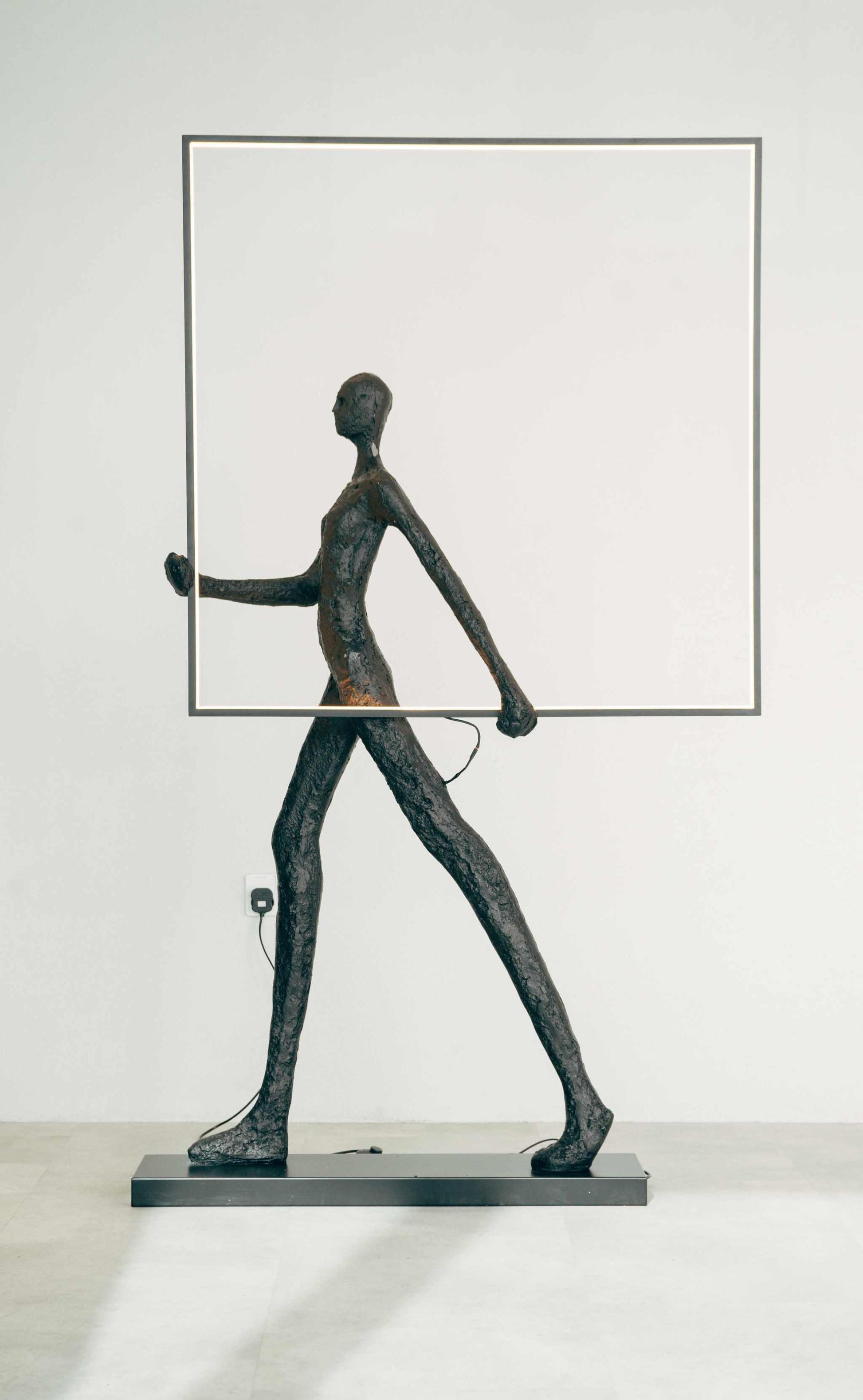 Walking Sculpture with Medium Square Framed Lamp - BlackAdd a touch of contemporary artistry to your space with this Walking Sculpture Lamp with Square Frame. This unique lamp combines modern design and functionality, feaFloor Lamp