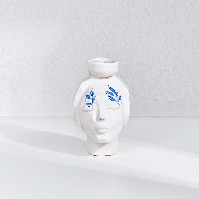 CERAMIC HAND MADE girl face candle holder on white background