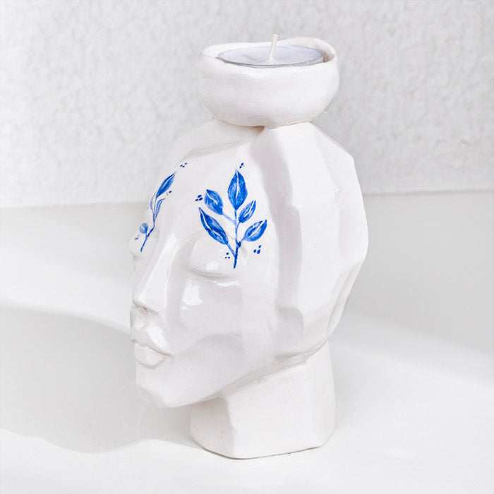 CERAMIC HAND MADE girl face candle holder with artistic design.