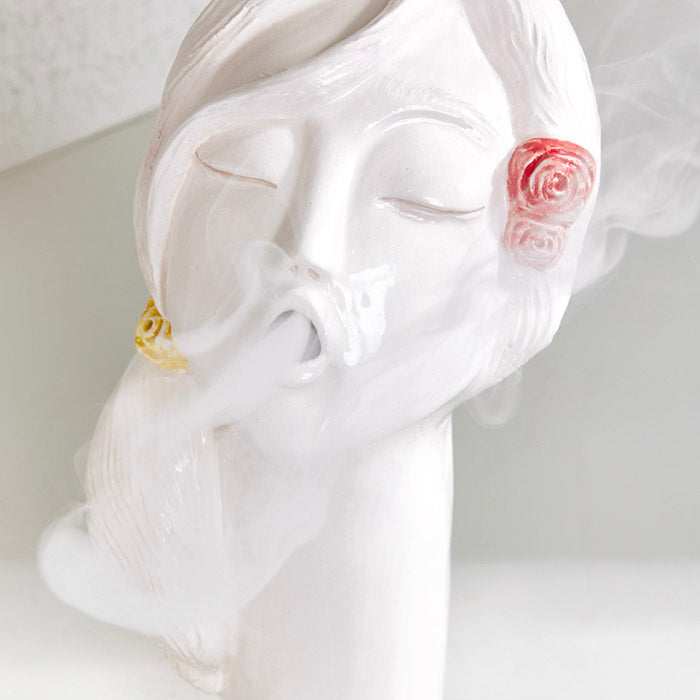 Ceramic handmade rose flower girl oud burner with artistic girl-face design emitting smoke.