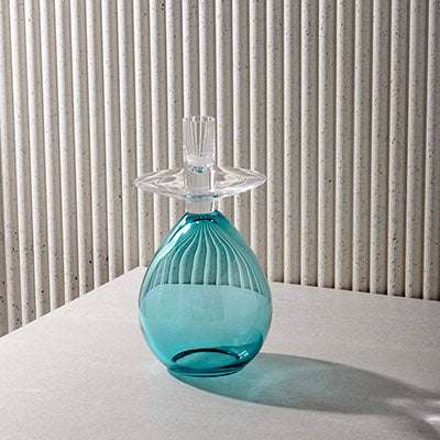 PRINCESS SAMDAN TURQUOISE candle holder with elegant turquoise glass design and clear top.