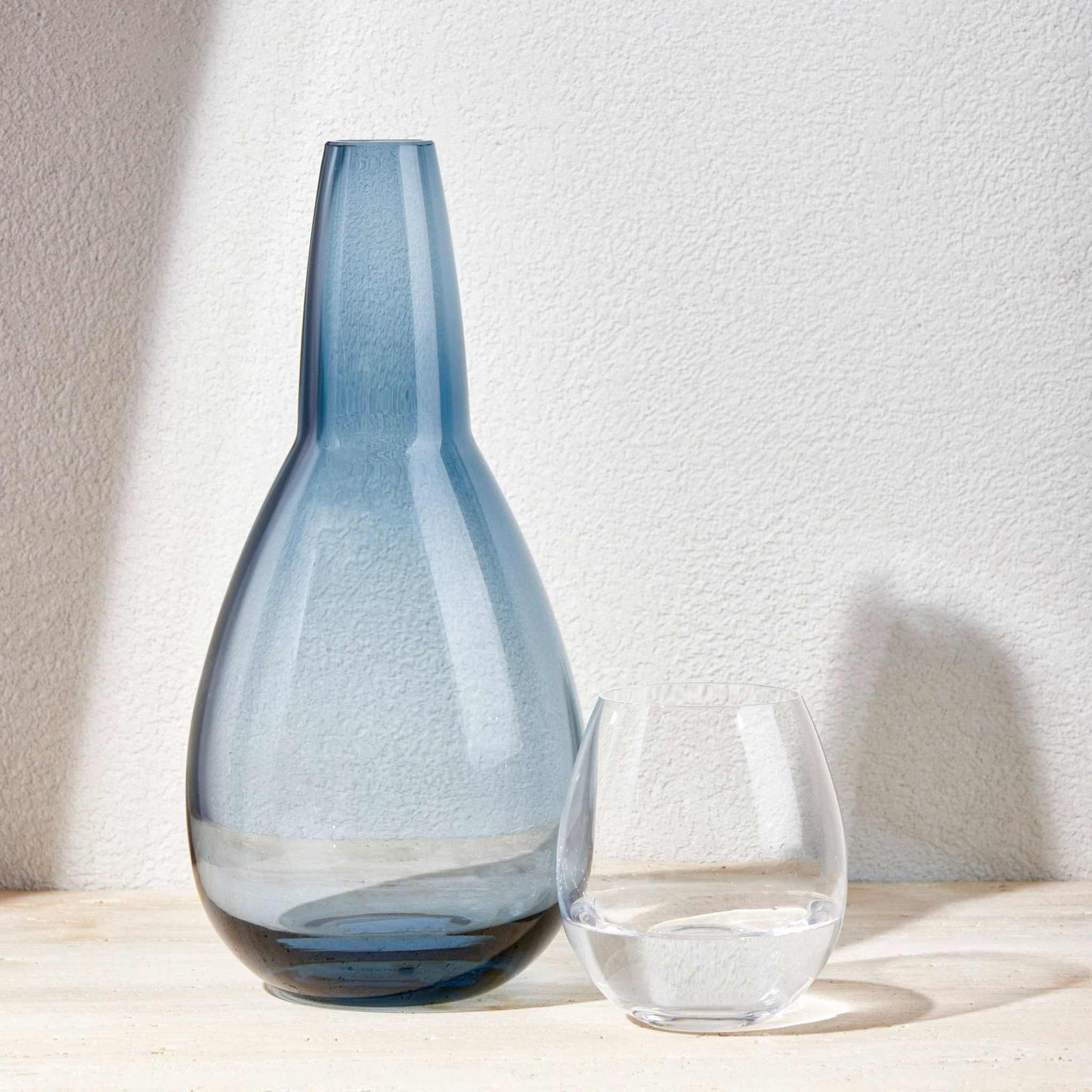 NIGHT WATER SET 1.5 Litre - STEEL BLUEElevate your bedside or tabletop with the STEEL BLUE Set in a warm and elegant red . Designed for both style and function, this sophisticated set includes a beautifuBottle