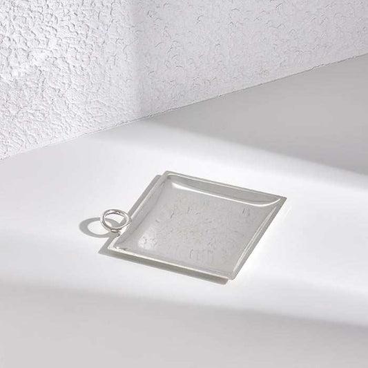 Silver tray with ring handle, 15x15cm, high-quality silver-plated metal, minimalist design.