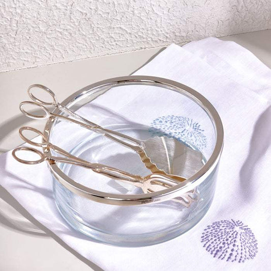 SALAD TONG SILVER with a polished finish, crafted from stainless steel, elegantly placed in a glass bowl.