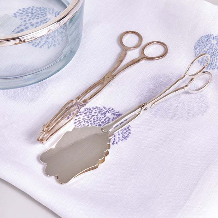 Sleek silver salad tongs with polished stainless steel for serving.