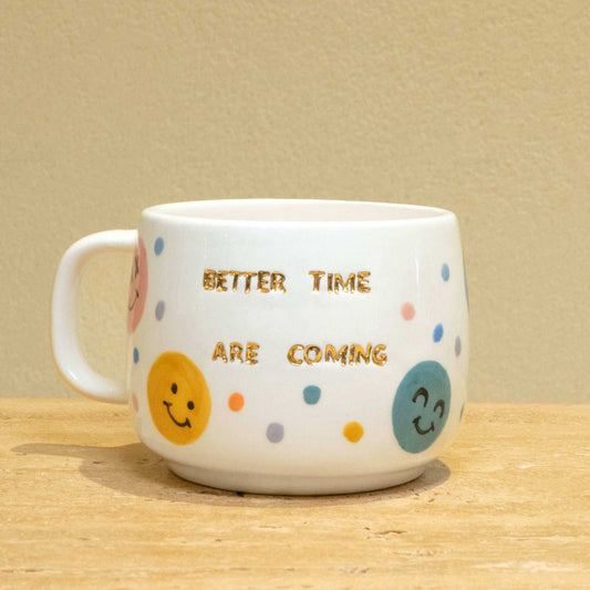 Custom handmade ceramic mug with gold-plated positive quotes and vibrant floral artwork.